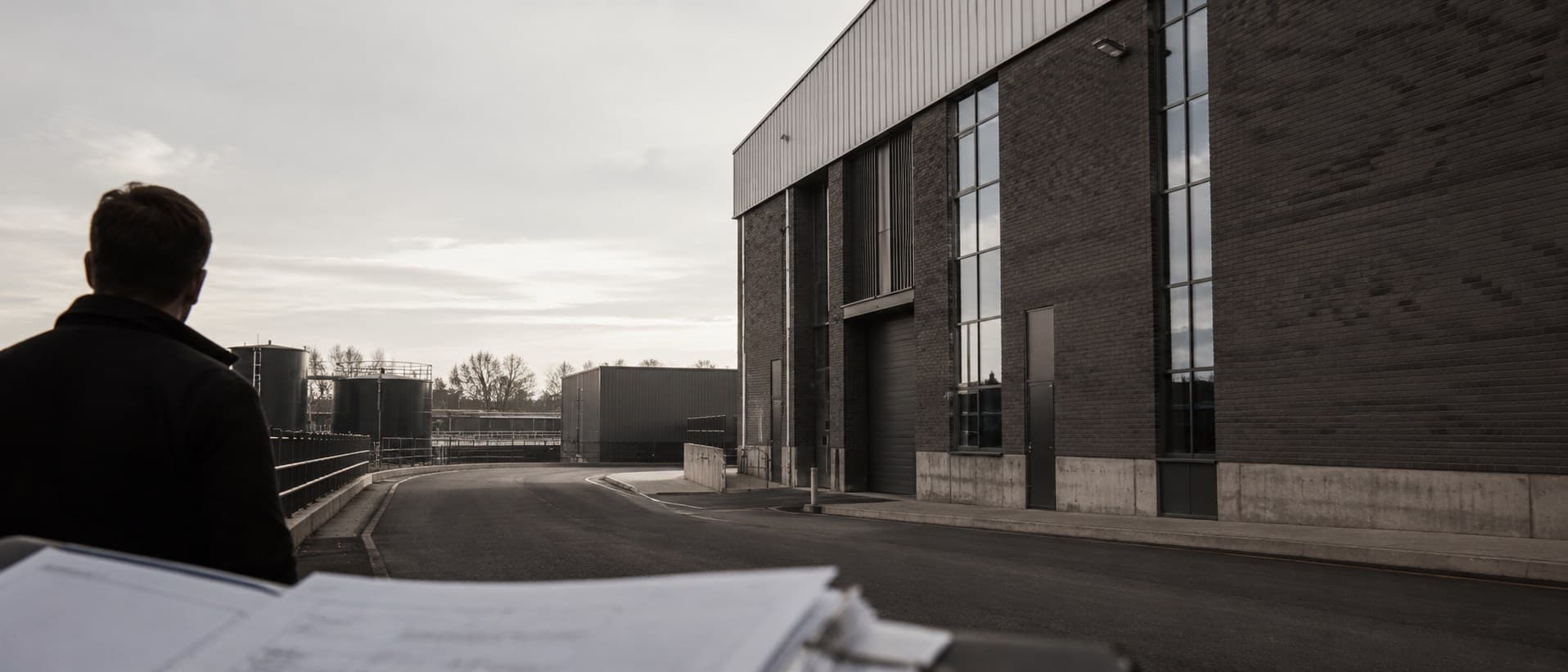 A Stratton specialist surveying a commercial site from the approach road.