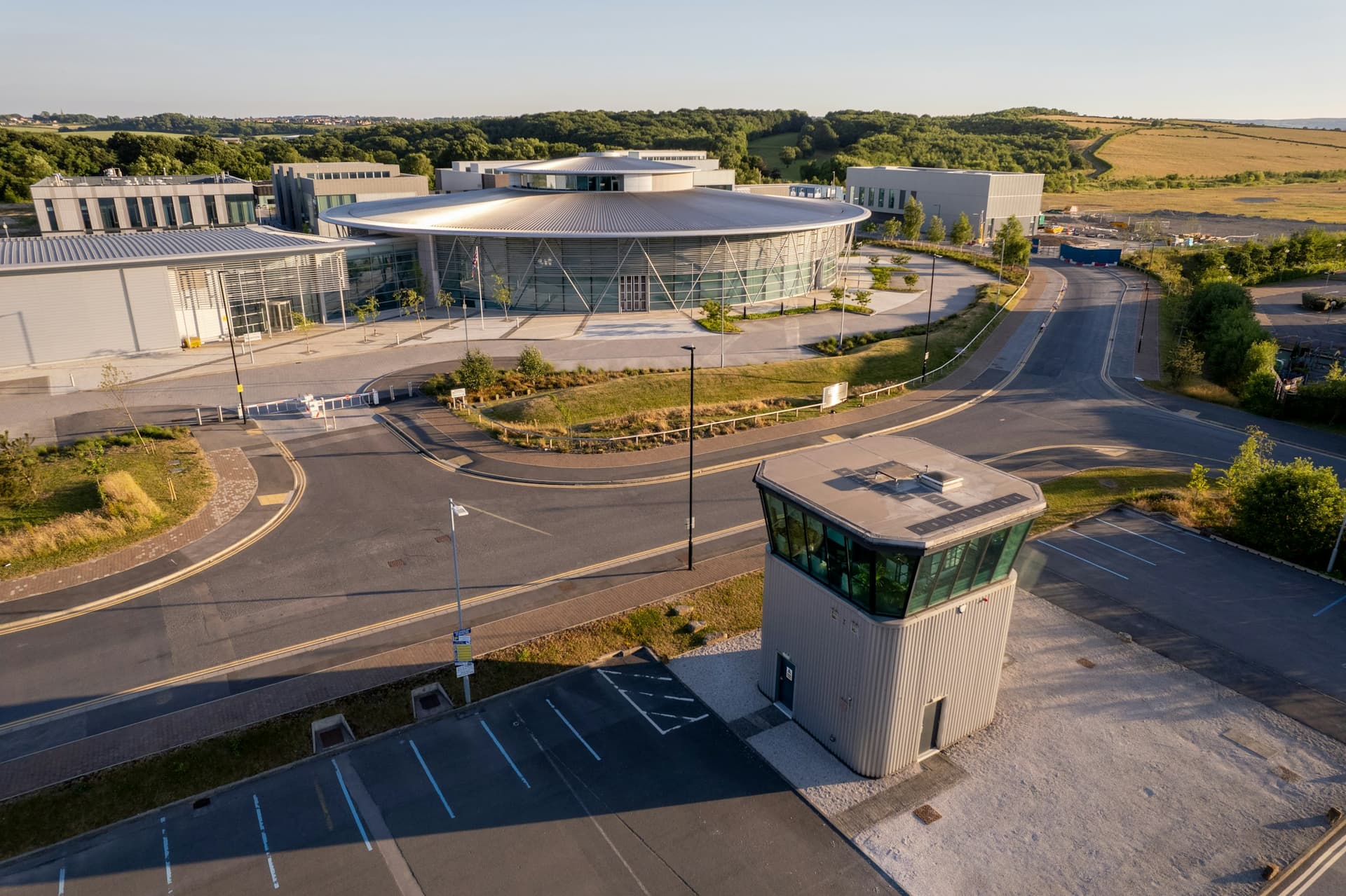 A modern research and engineering campus near Sheffield, from the air in low sun.
